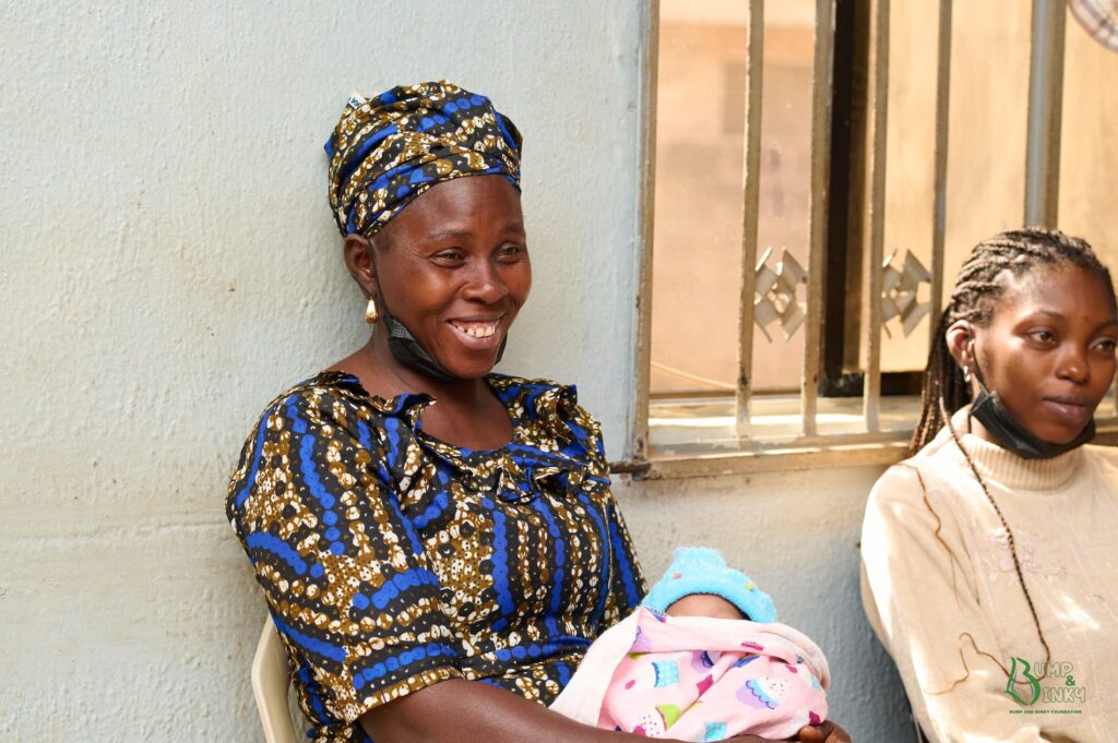mother smiling with baby